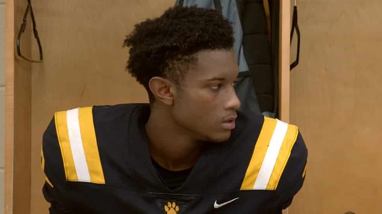 Amari Jones in conversation in locker room