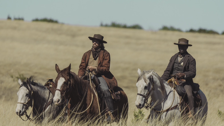 Garrett Hedlund and David Oyelowo riding horses