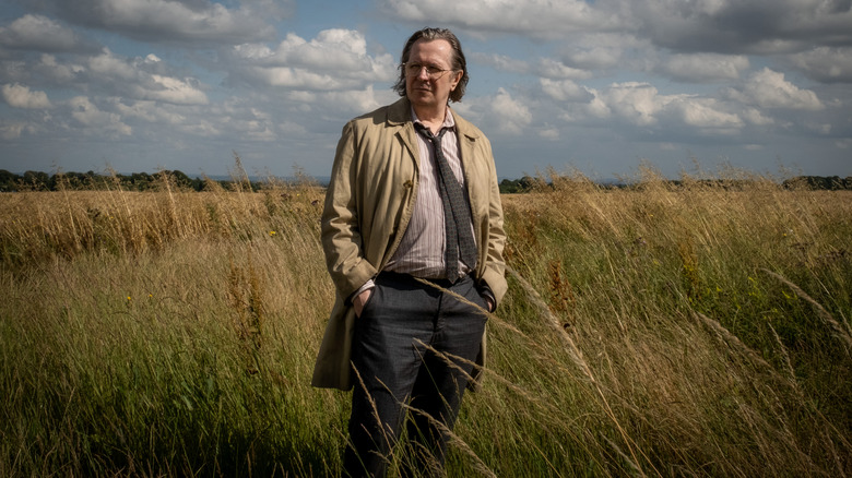 Jackson Lamb standing in a field