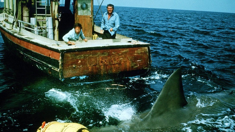 Hooper on boat with shark