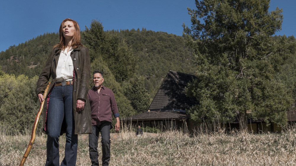 Cady and Jacob in front of a cabin