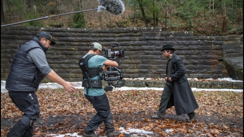 Behind-the-scenes photo of camera crew filming Christian Bale