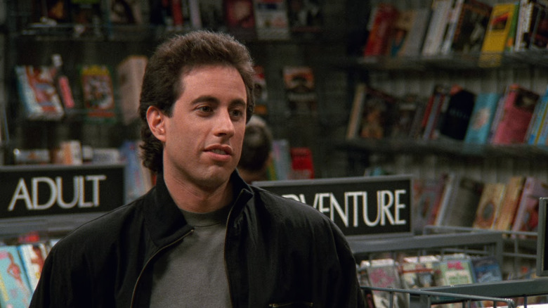 Jerry Seinfeld in Champagne Video with movies in background