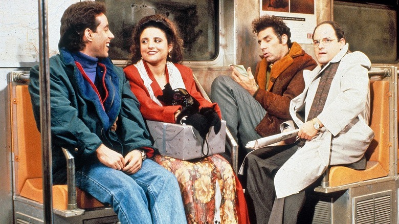 Jerry, Elaine, Kramer, and George sitting in subway car (1992)