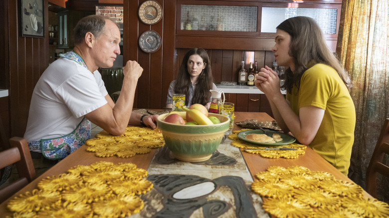 E. Howard Hunt, Lisa, and St. John sitting at a table