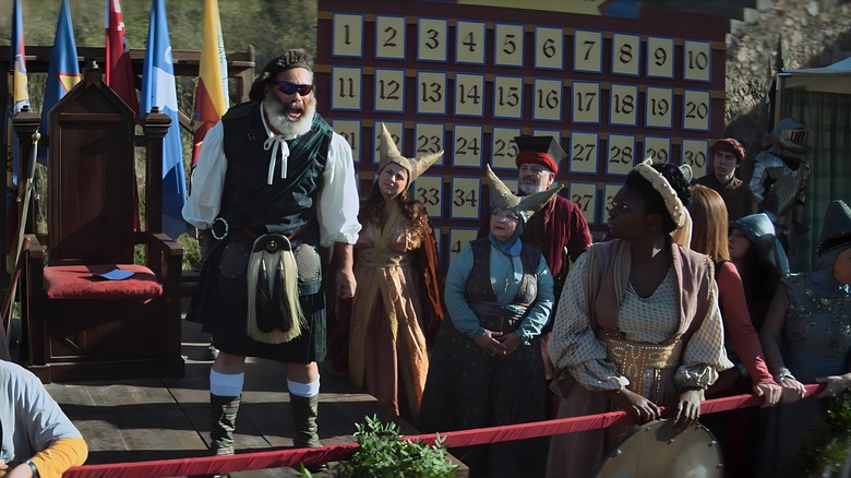 Contestants gathering around giant Excalibur 