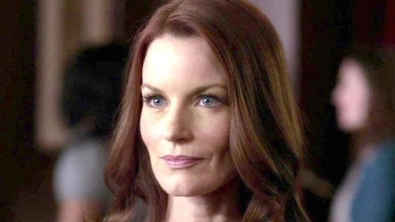 Laura Leighton gazes at someone