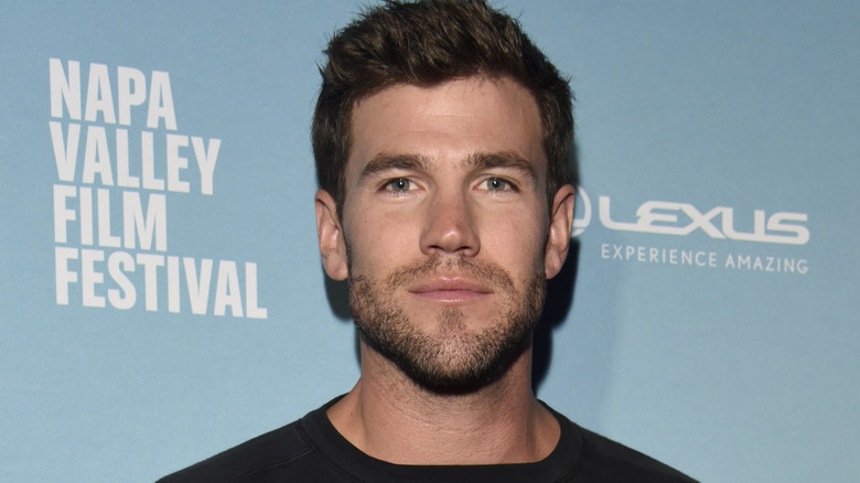 Austin Stowell wearing a black shirt