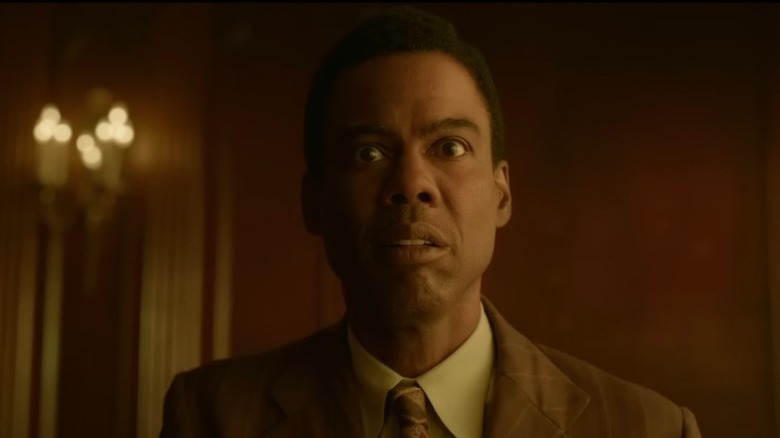 Chris Rock with a concerned look