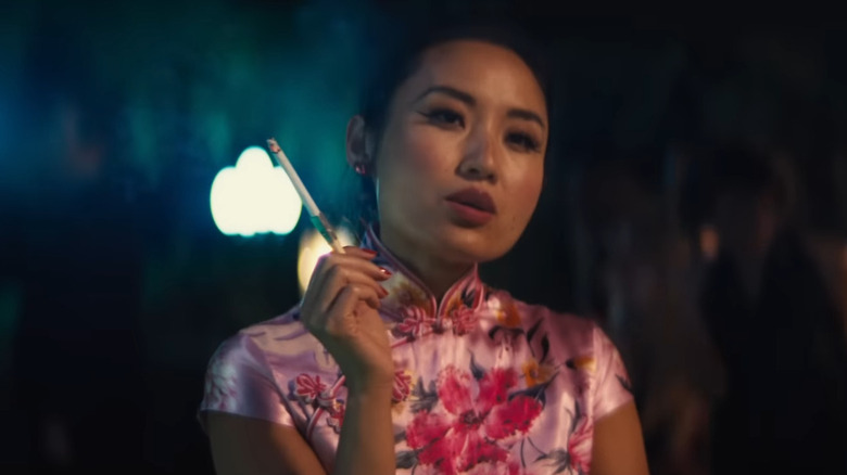 Li Jun Li smoking a cigarette