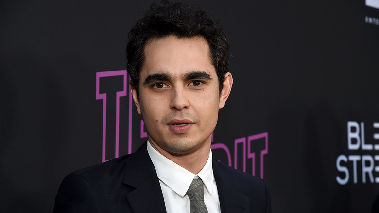 Max Minghella in a suit