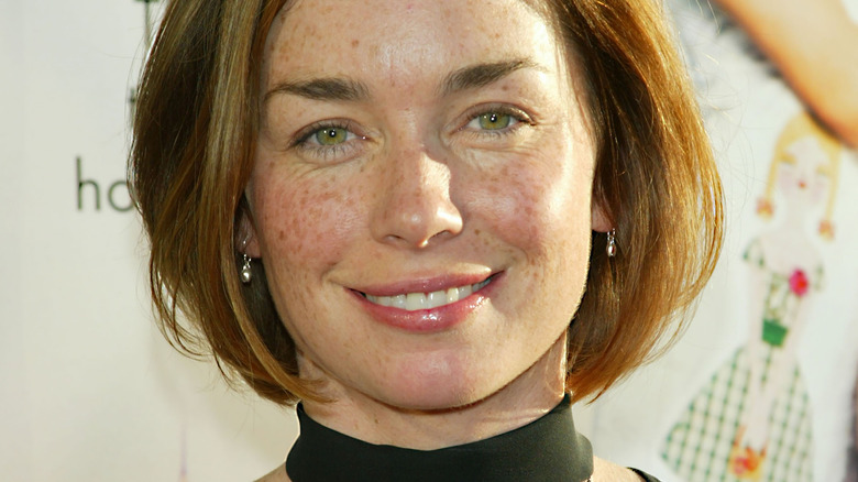 Julianne Nicholson smiling in a green dress