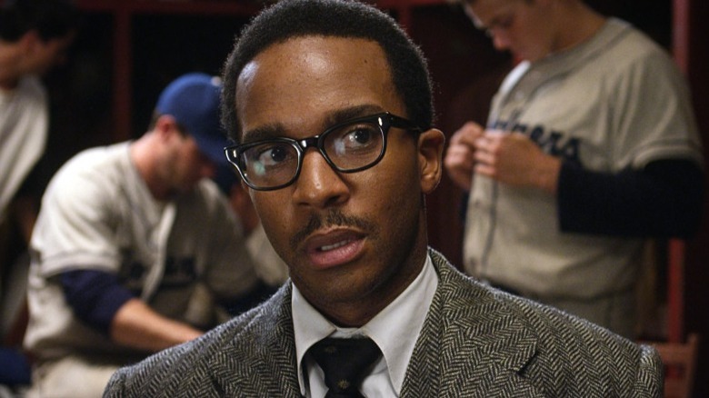 André Holland wearing eye glasses