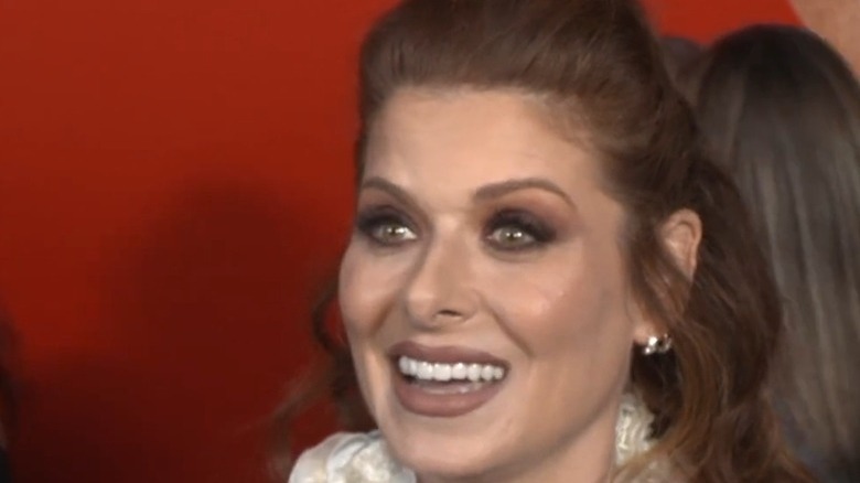 Debra Messing smiling at premiere