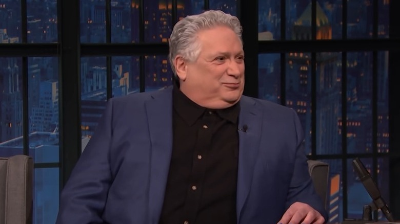 Harvey Fierstein sitting on Seth Meyers' show