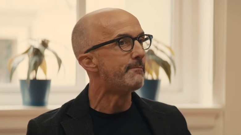 Jim Rash as Robert attending meeting