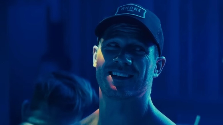 Luke Macfarlane as Aaron smiling in club