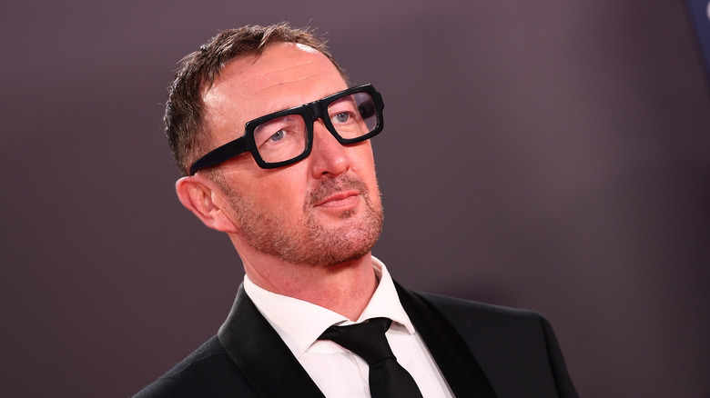 Ralph Ineson wearing glasses