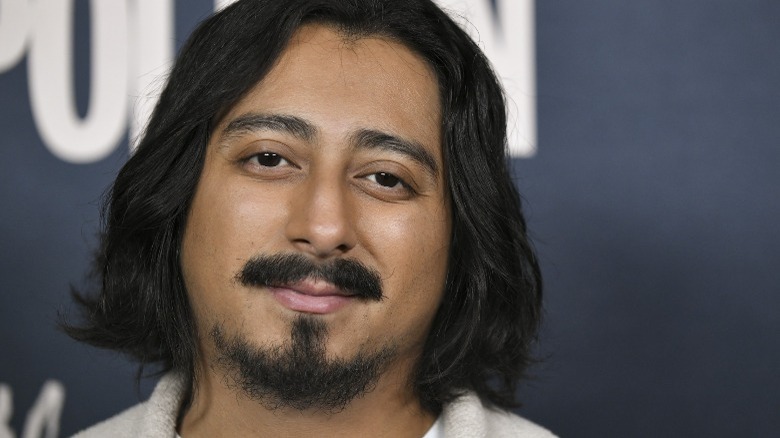 Tony Revolori smiling at an event