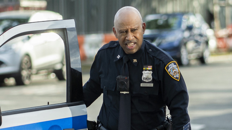 Ruben Santiago-Hudson stepping out of a police car on "East New York"