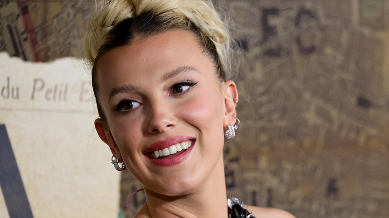 Millie Bobby Brown smiling on red carpet