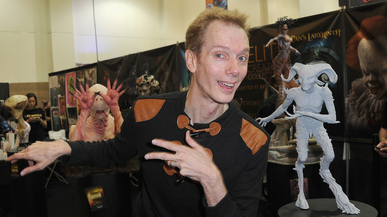 Doug Jones posing with his Pan's Labyrinth characters