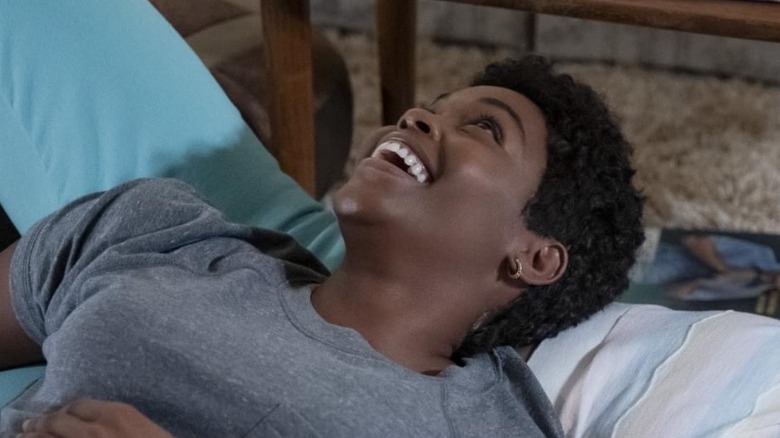 Nafessa Williams lying on Naomi Ackie