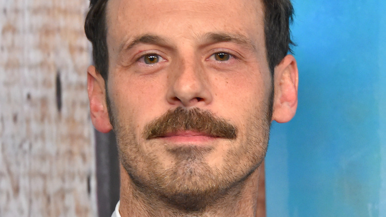 Scoot McNairy smiling with a moustache