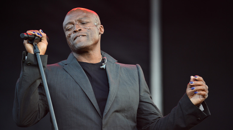 Seal holding microphone on stage