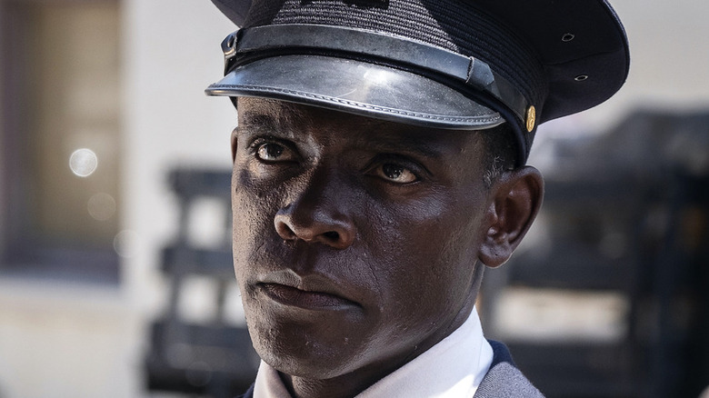 Chris Chalk in police hat