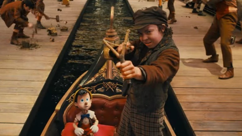 Lampwick firing a slingshot