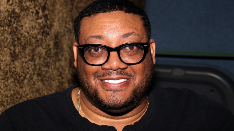 Cedric Yarbrough smiling in glasses