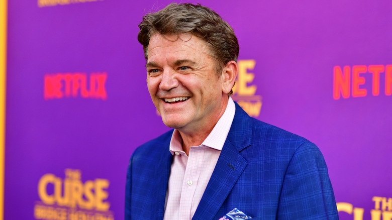 John Michael Higgins wearing a blue suit