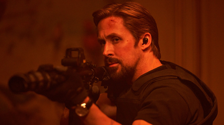 Ryan Gosling as Six aiming a rifle in The Gray Man