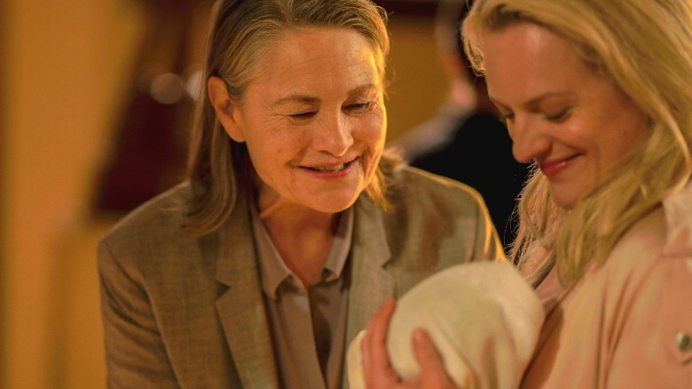 Holly smiling at baby Hannah