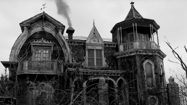 The Munsters' house with smoke rising from the chimney