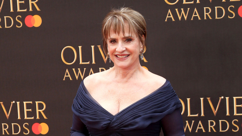 Pattie LuPone wearing a navy dress