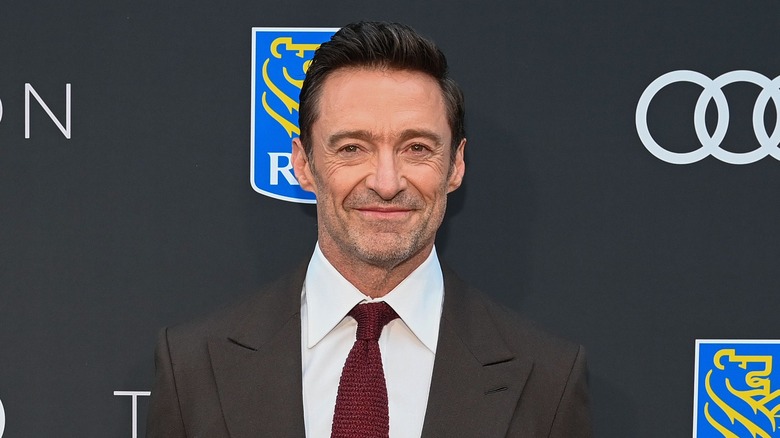 Hugh Jackman wearing a red tie