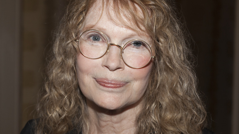Mia Farrow wearing glasses