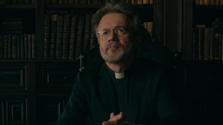 Father Vincent sitting at his desk