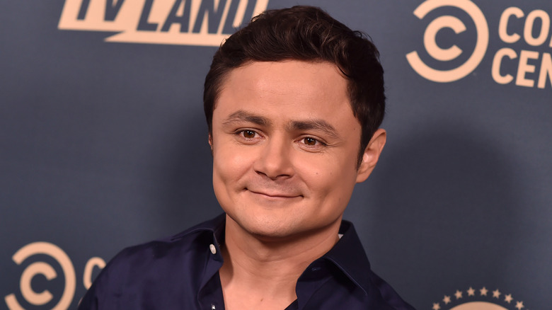 Arturo Castro smiling on red carpet