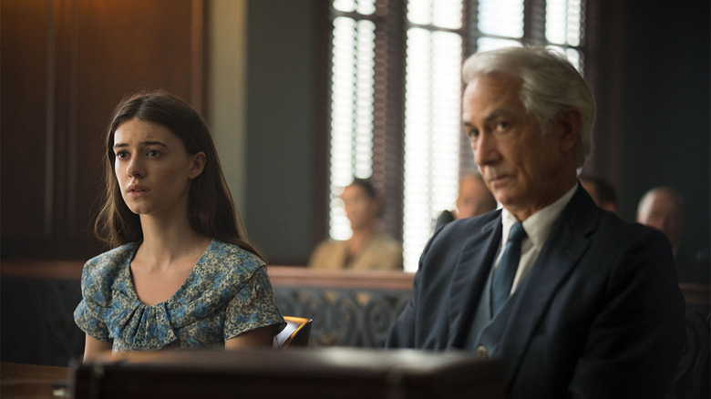 Tom Milton sits beside Kya Clark in a courtroom