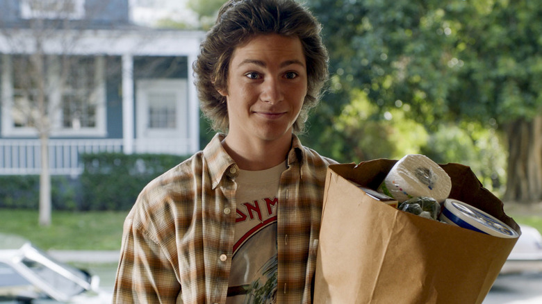 George Jr. holds groceries