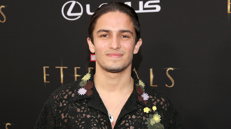 Aramis Knight smiling floral shirt