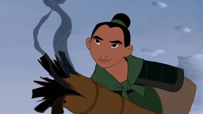 Smirking Mulan holds used firework