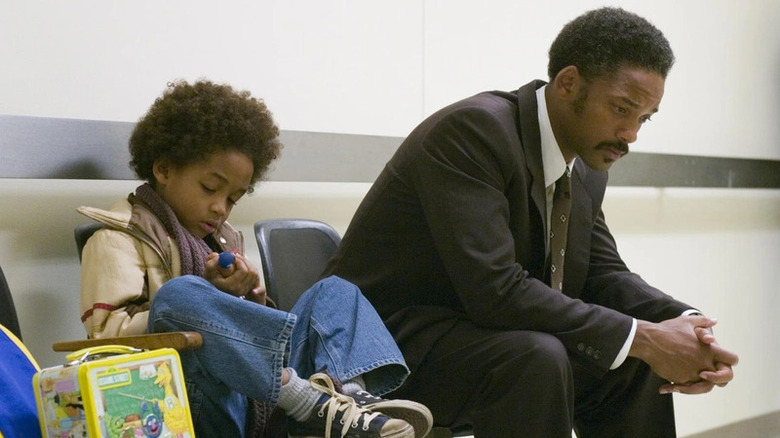 Chris Gardner sitting with son