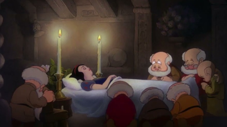 The seven dwarfs mourning Snow White