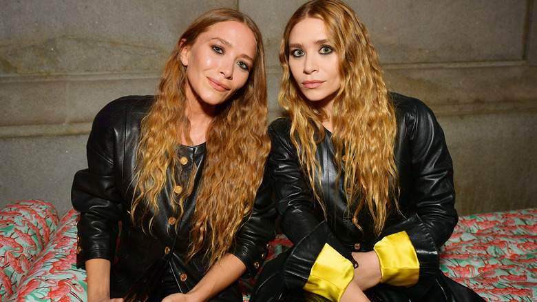 Mary-Kate and Ashley Olsen sitting together