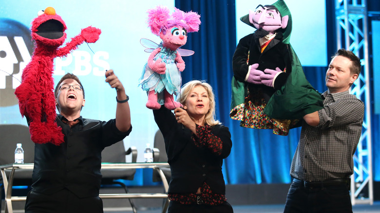 Ryan Dillon, Matt Vogel, and Leslie Carrara-Rudolph performing their Sesame Street characters