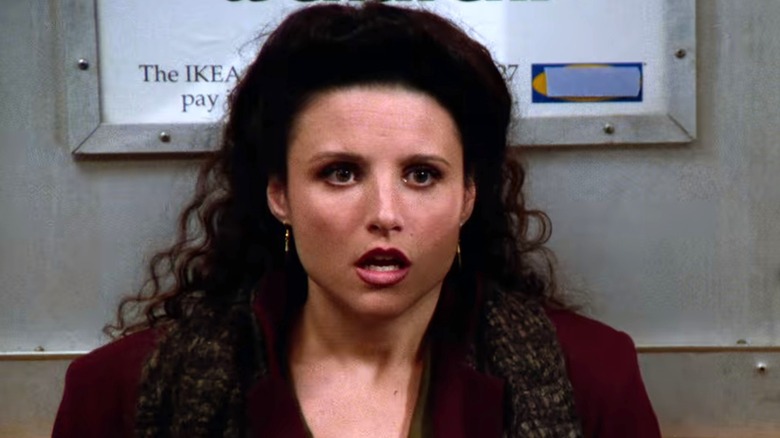 Elaine Benes looking forward shocked